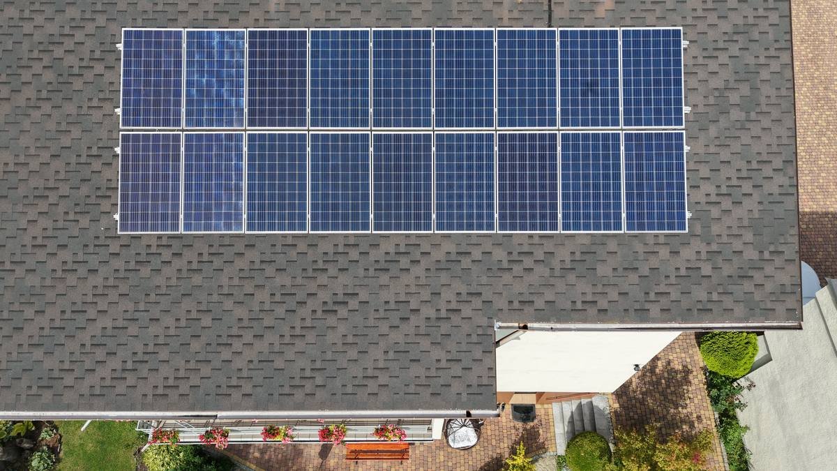 Aerial drone photo of a rooftop solar panel array